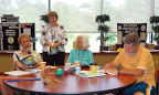 Participants respond to questions discussed at their table.